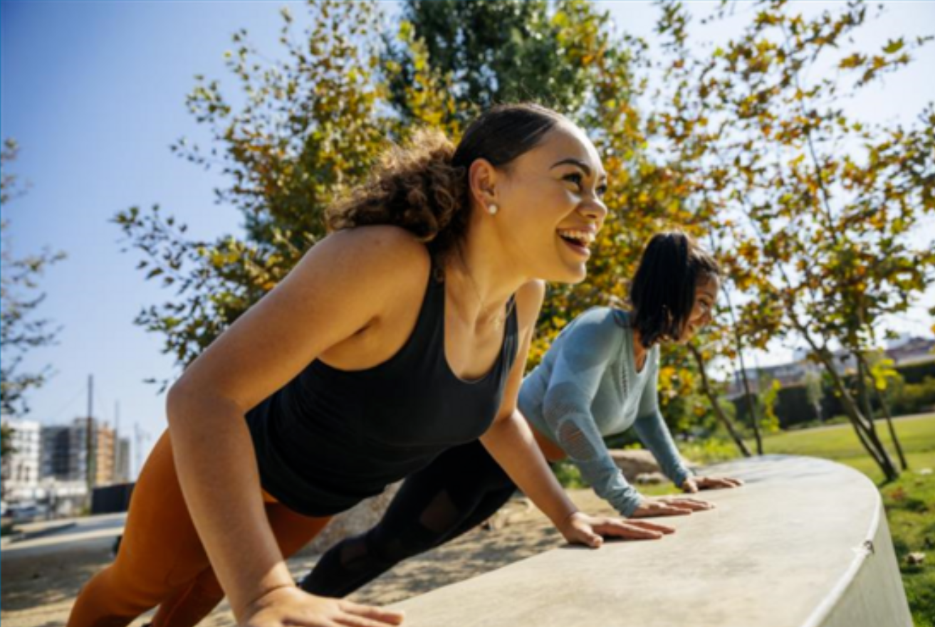 Two women exercising outside