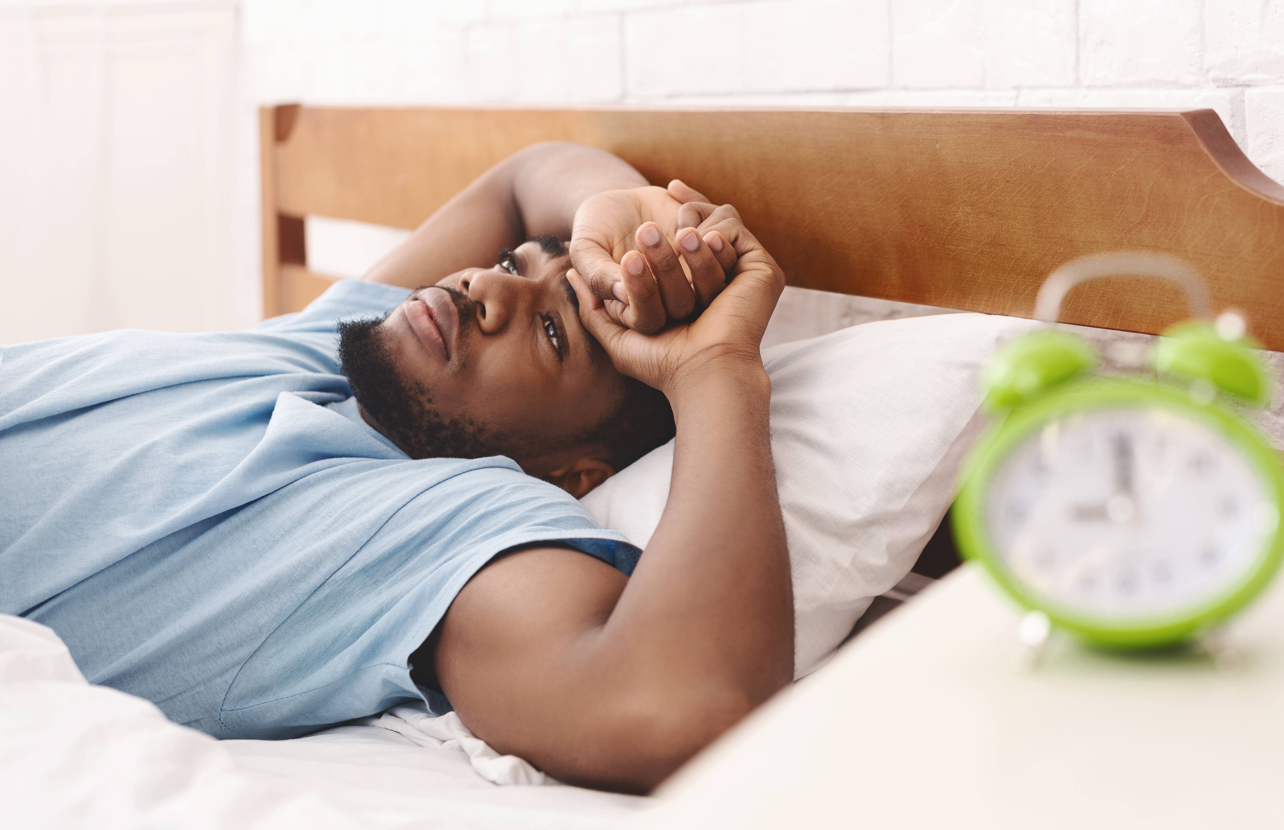Man laying down in bed