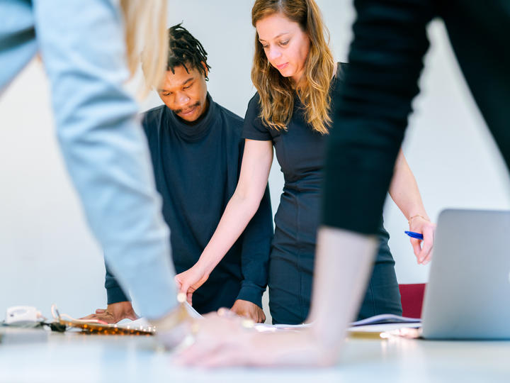 people looking at table