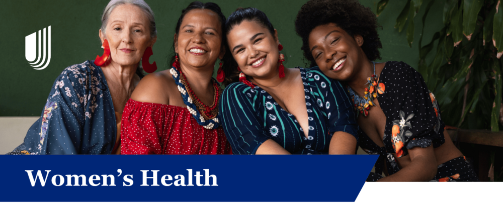4 women sitting together and smiling