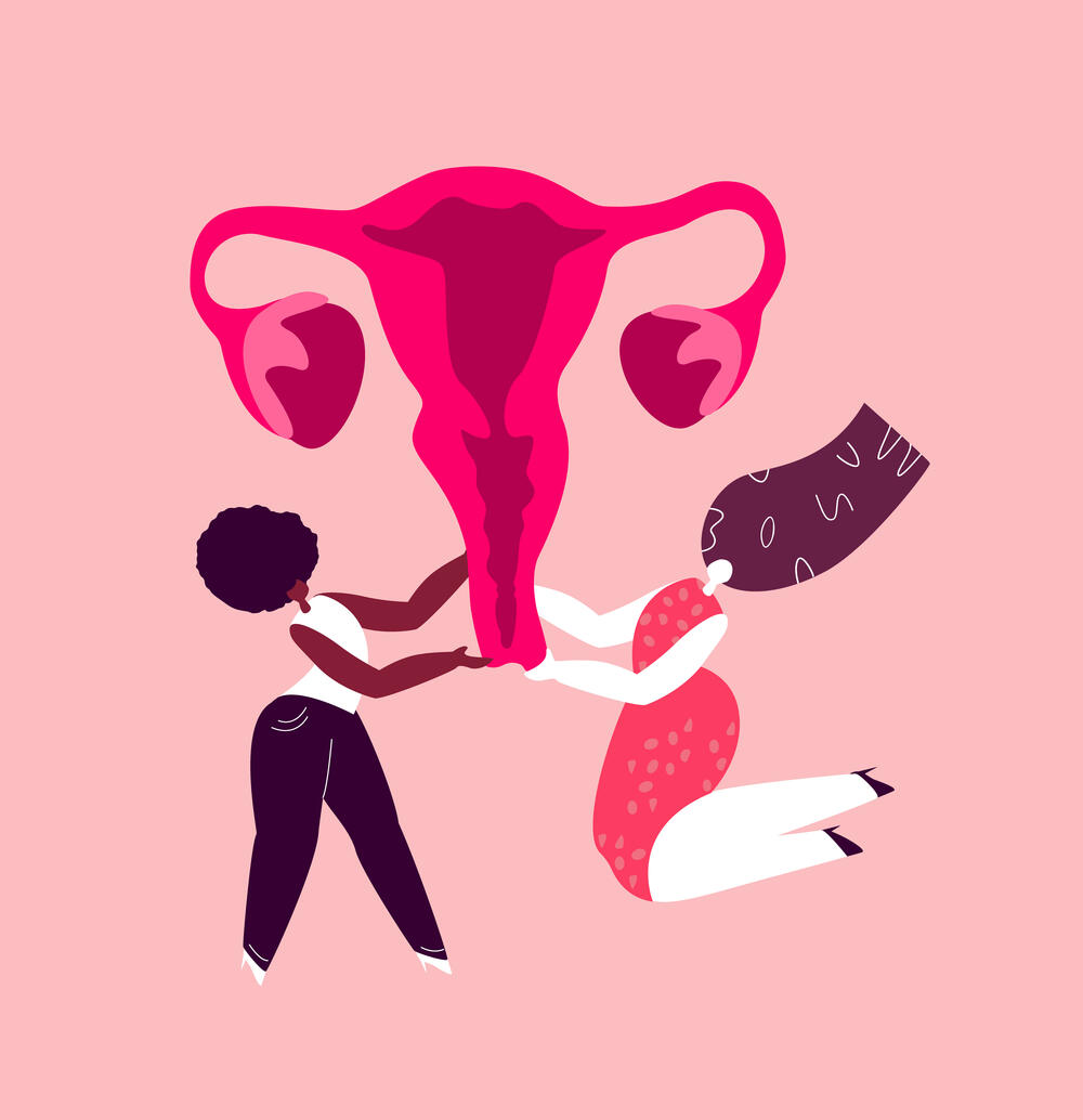 Cartoon illustration of two women holding up a uterus
