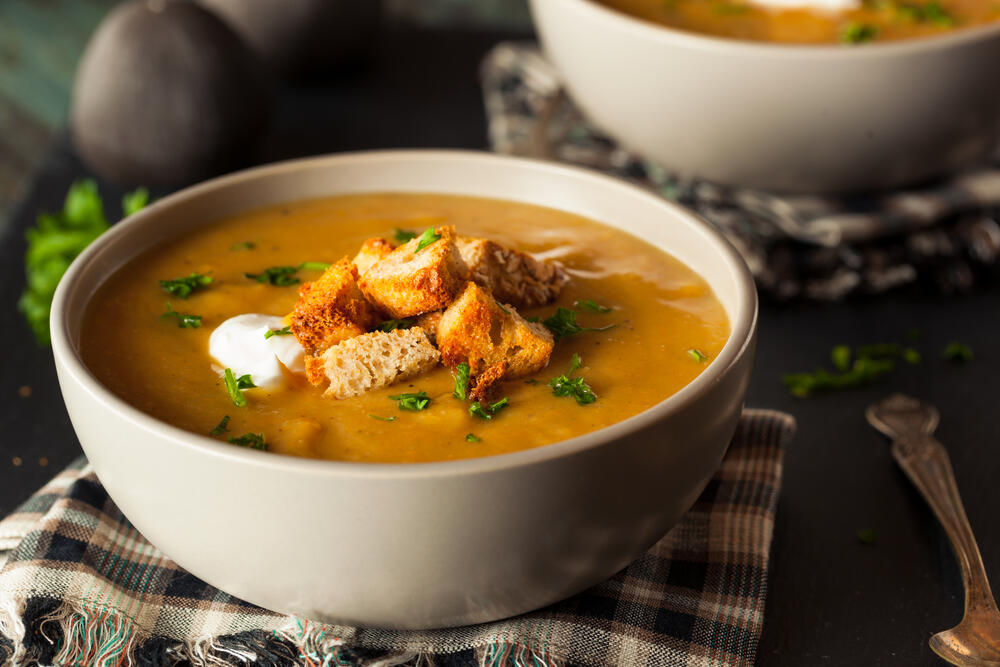 Bowl of orange colored soup